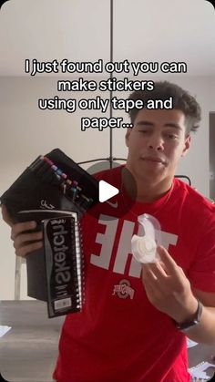 a young man holding up a piece of paper with the text just found out you can make stickers using only tape and paper