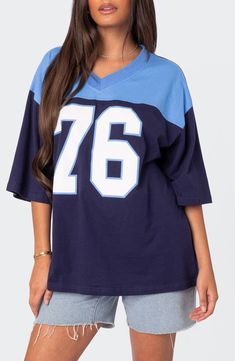 Your favorite year, your team number or your lucky number—keep 'em all guessing when you slip into the oversized jersey-inspired T-shirt made from soft cotton. V-neck Elbow-length sleeves 100% cotton Machine wash, dry flat Imported Football Girl, Oversized Jersey, Grunge Clothes, Jersey Outfit, Streetwear Aesthetic, Short Sleeve Tops, Streetwear Y2k, T Shirt Oversized, Aesthetic Grunge