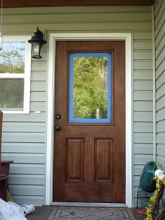 a front door with a glass pane on it