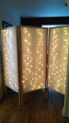 a room divider with lights on it