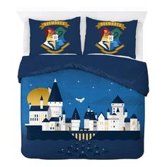 an image of a bed with blue comforters and castle decorations on it's side