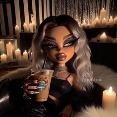 a doll holding a drink in her hand and wearing black makeup with candles behind it