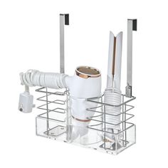 a white kitchen sink faucet sitting on top of a metal rack with dishes and utensils in it