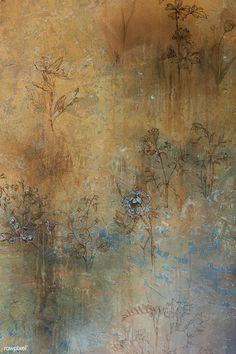 an abstract painting with blue and brown flowers in the middle, against a gold background