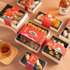 there are many different types of sushi in the boxes and on the trays