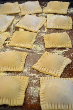 homemade ravioli on a baking sheet ready to go into the oven