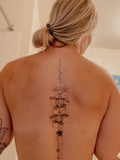 a woman with a tattoo on her back