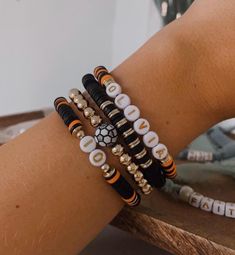 Calling all soccer mamas Customize this stack with your kiddo's name, number, and team colors  If you have more than one kiddo playing soccer, send a message! we can add more bracelets to represent all of your littles  These bracelets are made with elastic string, clay disc beads, and 14K gold filled beads Bracelets are all made 6.75" in diameter. If you need a different size, please tell me in the personalization box! Team Beaded Bracelets, Personalized Black Sporty Bracelets, Sporty Personalized Black Bracelets, Sporty Personalized Black Bracelet, Soccer Bracelet, Team Bracelets, Mama Bracelet, Mom Bracelet, Playing Soccer