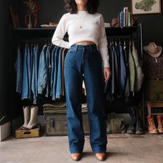 "Vintage 70s Levis Wide Leg Jeans Nice dark wash denim High waisted fit that hugs the top of the hips w/ a Wide straight leg Size measured flat: 27\"x32\" Model: 5'2\" wearing 2\" heel boots - Waist: 27\" (across top waistband) - Inseam: 32\" (crotch seam to bottom hem) - Rise: 11\" (crotch seam to top of waist) - Hips: 20\" (straight across below end of zipper) - Thigh: 10.5\" (crotch seam to outseam) - Knee: 9\" - Cuff: 9\" (lower leg opening) Please use listed measurements for sizing. Do not Dark Wash Straight Leg Jeans, Retro Dark Wash Relaxed Fit Flare Jeans, Dark Wash Retro Relaxed Fit Flare Jeans, Vintage Flare Jeans With Five Pockets For Everyday, Vintage Everyday Flare Jeans With Five Pockets, Vintage Dark Wash Pants For Fall, Everyday Vintage Flare Jeans With Five Pockets, Vintage Flare Jeans In Dark Wash With Relaxed Fit, Vintage Medium Wash Bottoms For Fall