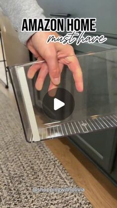 someone is opening the microwave door to see what's inside it and how to use it