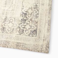 an antique rug with fringes on the bottom and a medallion design on the middle