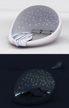 there is a bed in the shape of a ball with lights on it and underneath