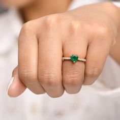 Real emerald heart shape ring 14K gold | Natural 1.20ct big emerald heart diamond ring gold | Emerald pinky ring | Emerald cut proposal ring GEMSTONE DETAILS : ✦ Gemstone : Emerald ✦ Gemstone Type : Natural ✦ Gemstone Size : 7 MM ✦ Gemstone Shape : Heart ✦ Number of Gemstones : 1 ✦ Gemstone Weight : 1.20 Carats ✦ Gemstone Grade : AAA DIAMOND DETAILS : ✦ Diamond Type : Natural ✦ Diamond Size : 1.00 mm ✦ Diamond Color : F-G ✦ Diamond Clarity : Slightly included ✦ Diamond Cut : Excellent - Very Goo Heart-shaped Emerald Rings For Wedding, Green Diamond Heart Cut Ring, Heart Cut Green Emerald Ring, Green Emerald Heart Cut Ring With Prong Setting, Green Heart Cut Emerald Ring With Prong Setting, Heart Cut Emerald Ring For Wedding, Heart Cut Emerald Promise Ring For May Birthstone, Green Heart Cut Ring For Wedding, Heart-shaped Emerald Ring For Anniversary