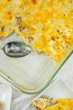 a casserole dish with meat and cheese in it on a white tablecloth