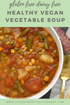 a white bowl filled with vegetable soup on top of a table