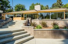 a house with concrete steps leading up to it