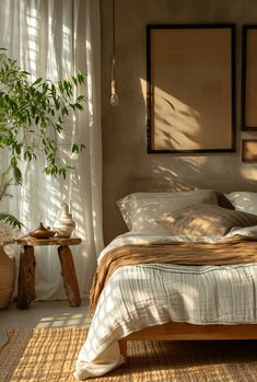 a bed sitting in a bedroom next to a window covered in curtains and pillows on top of a rug