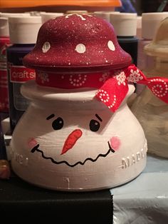 a close up of a snowman on a table