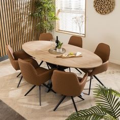 a dining table with six chairs around it