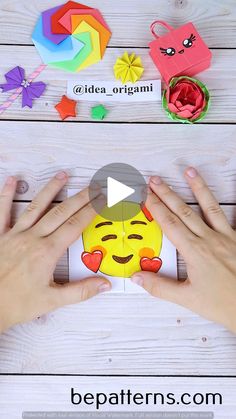 someone is making an origami emoticure with their hands and the video below shows how to make it