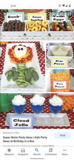 an assortment of food items displayed on trays at a birthday party or baby shower