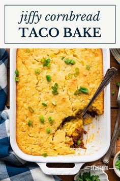 a casserole dish filled with taco meat and topped with scallions