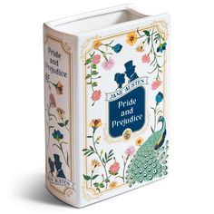 a book with an image of a peacock and flowers on the cover, in front of a white background