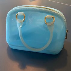 Mini Jelly Handbag From Lily Rain. Never Used. Light Blue Pouch Bag For Gift, Light Blue Pouch Bag As Gift, Trendy Blue Shoulder Bag For Gift, Blue Handheld Bag With Zipper Closure, Trendy Light Blue Bag For Gift, Blue Pouch Satchel For Shopping, Light Blue Bag With Top Carry Handle, Light Blue Everyday Bag With Top Carry Handle, Light Blue Bag With Top Carry Handle For Everyday