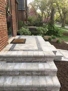 an outdoor patio with steps leading up to it