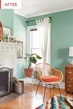 a living room with a fire place next to a window and a rug on the floor