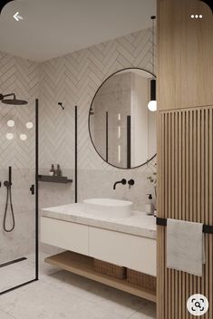 a bathroom with a sink, mirror and shower in it's center wall that has geometric tiles on the walls