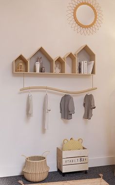 a shelf that has some clothes hanging on it