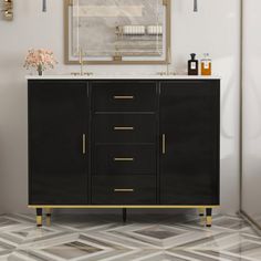 a bathroom vanity with a mirror above it and a vase on the counter next to it