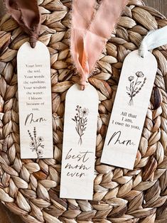 three bookmarks with the words best mom ever on them sitting in a woven basket