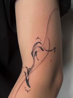 a woman's arm with a tattoo design on the left side of her body