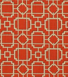 an orange and white geometric pattern on fabric