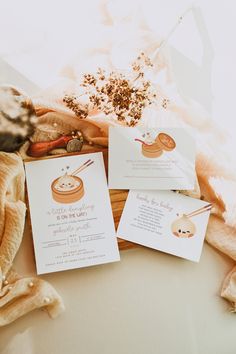 three cards with chopsticks on them sitting next to some other items in a basket