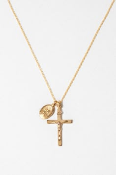 An iconic combination of a Roman Crucifix Cross and a "Miraculous Mary" petite oval charm. This necklace design is seen throughout history and found predominantly in Italy. 14k gold-filled or sterling silver pendant. 14K Gold-Filled or Sterling Silver Chain - Measures 16 Inches Available for custom order in 18, 20, 24 inches Mexican Necklace, Cross Necklace Gold, Crucifix Necklace Women, Chunky Cross Necklace, Gold Crucifix Necklace, Gold Pendants For Men, خواتم خطوبة, Petite Necklace, Crucifix Necklace