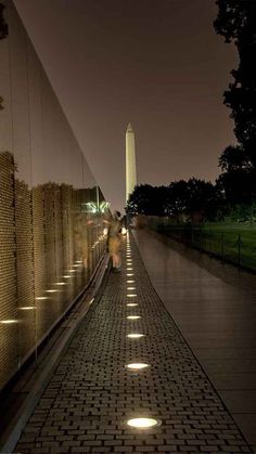 the washington monument and reflecting wall at night