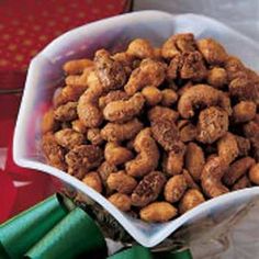 two bowls filled with nuts on top of a table