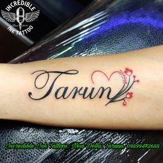 a tattoo with the word tarun written in cursive writing on it's arm