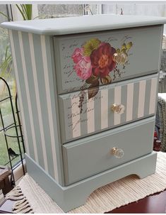 a dresser with flowers painted on the drawers