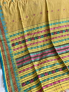 Beautiful pure cotton saree in vibrant color combinations with border design and a beautiful pallu.  Comes with blouse piece . Yellow Handloom Pre-draped Saree For Navratri, Festive Cotton Pre-draped Saree With Printed Border, Bohemian Handloom Pre-draped Saree, Unstitched Cotton Saree, Multicolor Cotton Saree With Weaving Work, Handloom Cotton Fabric For Festivals, Multicolor Cotton Saree With Weaving Details, Multicolor Cotton Saree With Border, Multicolor Cotton Saree For Puja