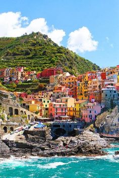 the colorful buildings are on top of the hill