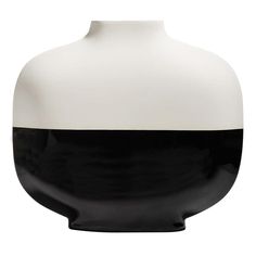 a black and white vase sitting on top of a table