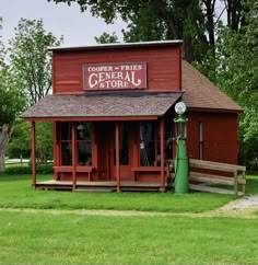 a red building with a sign that says general store on it's front porch