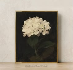 a painting of white flowers in a gold frame