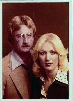 an old photo of two people posing for the camera with one woman's head tilted to the side