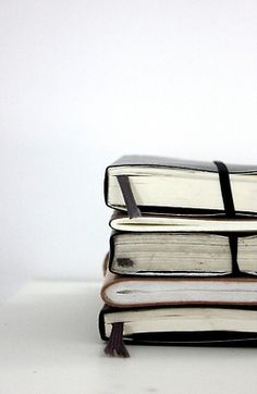 a stack of books sitting on top of each other