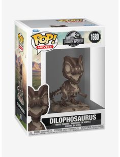 a pop vinyl figure in a box with an image of a dinosaur on it's back